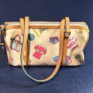 Dooney & Bourke Y2K Stylish Tan Barrel Printed Women's handbag.